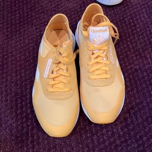 Yellow Reebok sneakers